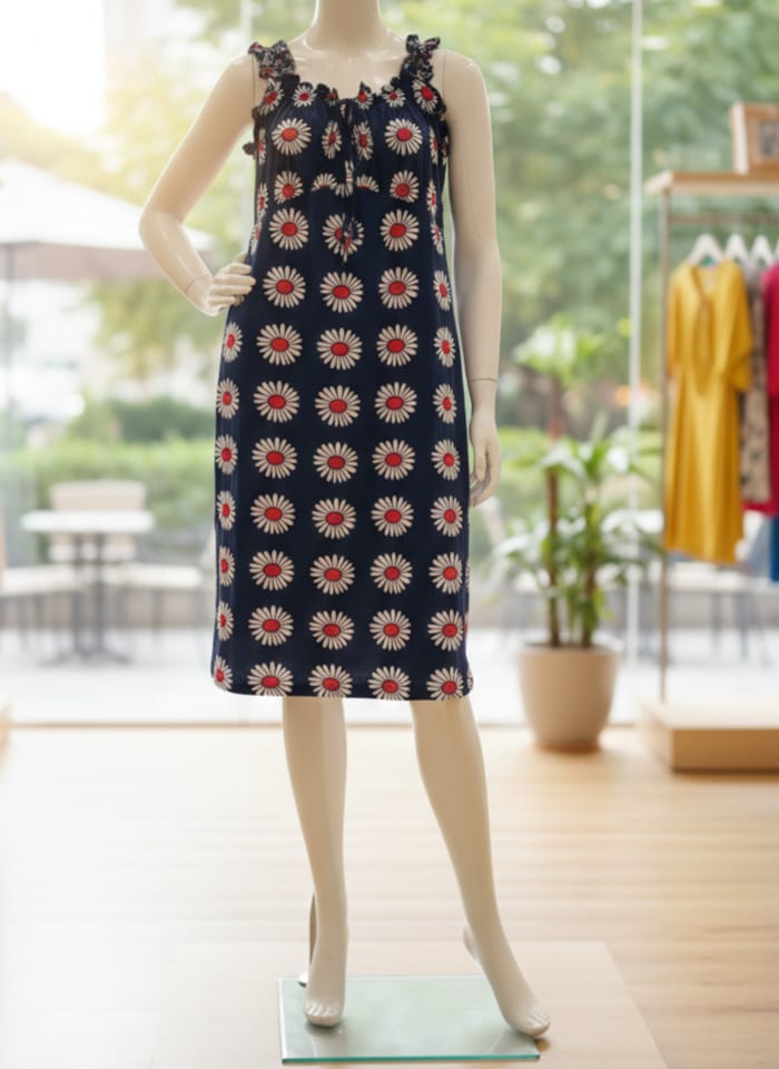 Mannequin wearing a floral dress in a store setting